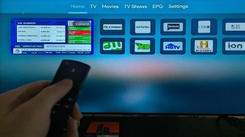 XPlay with Firestick Remote in Hand